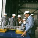 President Jimmy Carter, with wife Rosalynn and daughter Amy, listen to Lee R. Scherer, center director from 1974 to 1979, explain a model of the crawler-transporter during their tour of Kennedy Space Center.