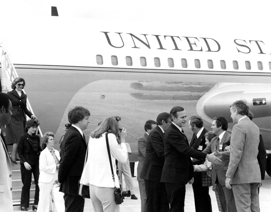 Vice President George H.W. Bush (center left) is welcomed to the Shuttle Landing Facility at Kennedy Space Center in 1982.