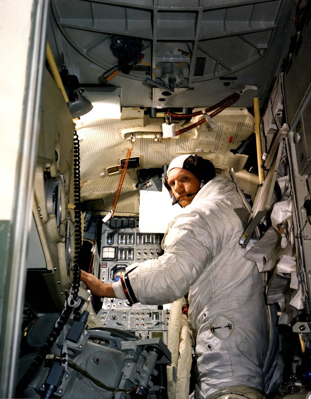 Neil A. Armstrong, commander for the Apollo 11 Moon-landing mission, practices for the historic event in a lunar module simulator in the Flight Crew Training Building at Kennedy.