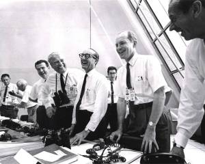 Apollo 11 mission officials relax in the Launch Control Center following the successful liftoff of Apollo 11.