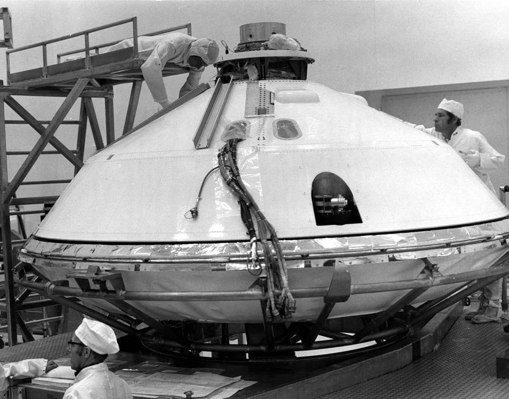 Technicians prepare for removal of Viking Lander 1's aeroshell cover in Kennedy's Spacecraft Assembly and Encapsulation Facility-2. 