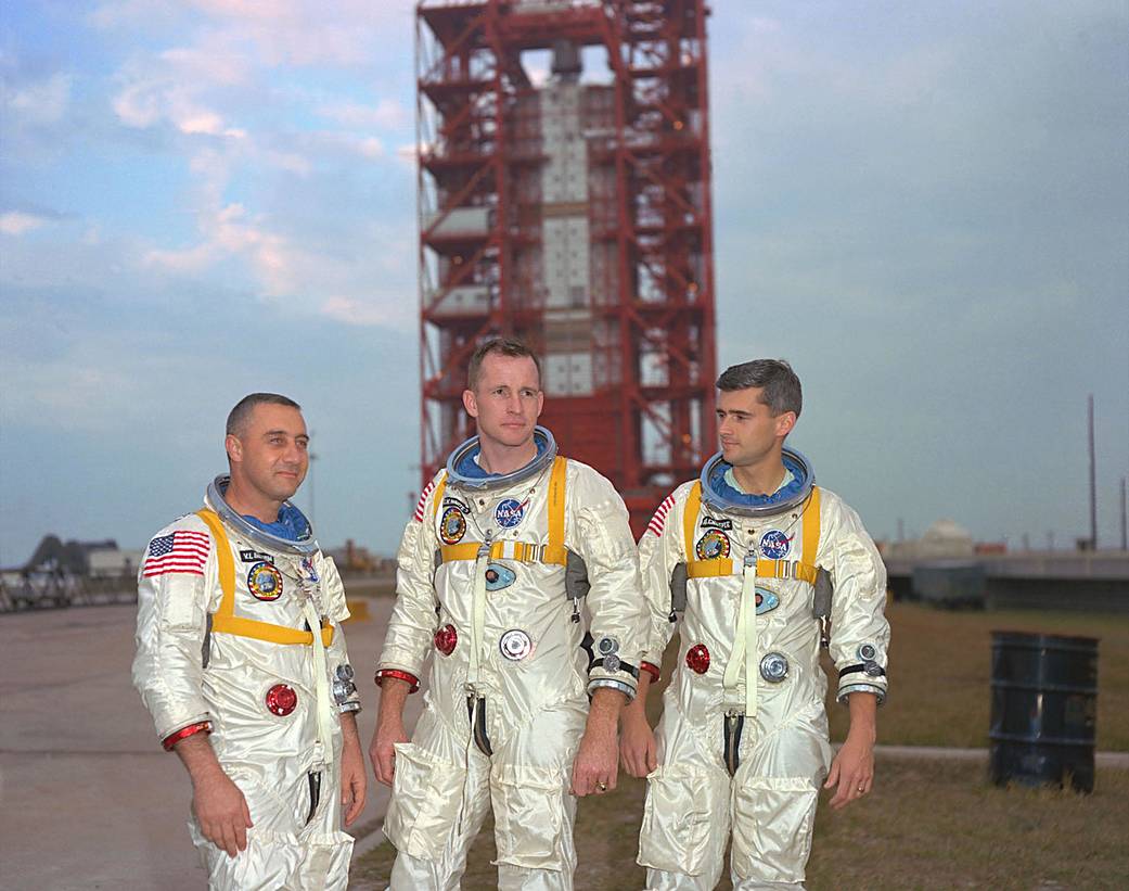 Apollo astronauts, left to right, Gus Grissom, Ed White, and Roger Chaffee, pose in front of Launch Complex 34, which housed the Saturn 1 rocket scheduled for the Apollo 1 mission.