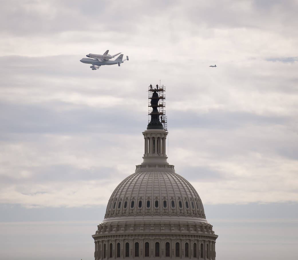 Space Shuttle Discovery Flown Over the U.S. Capitol
