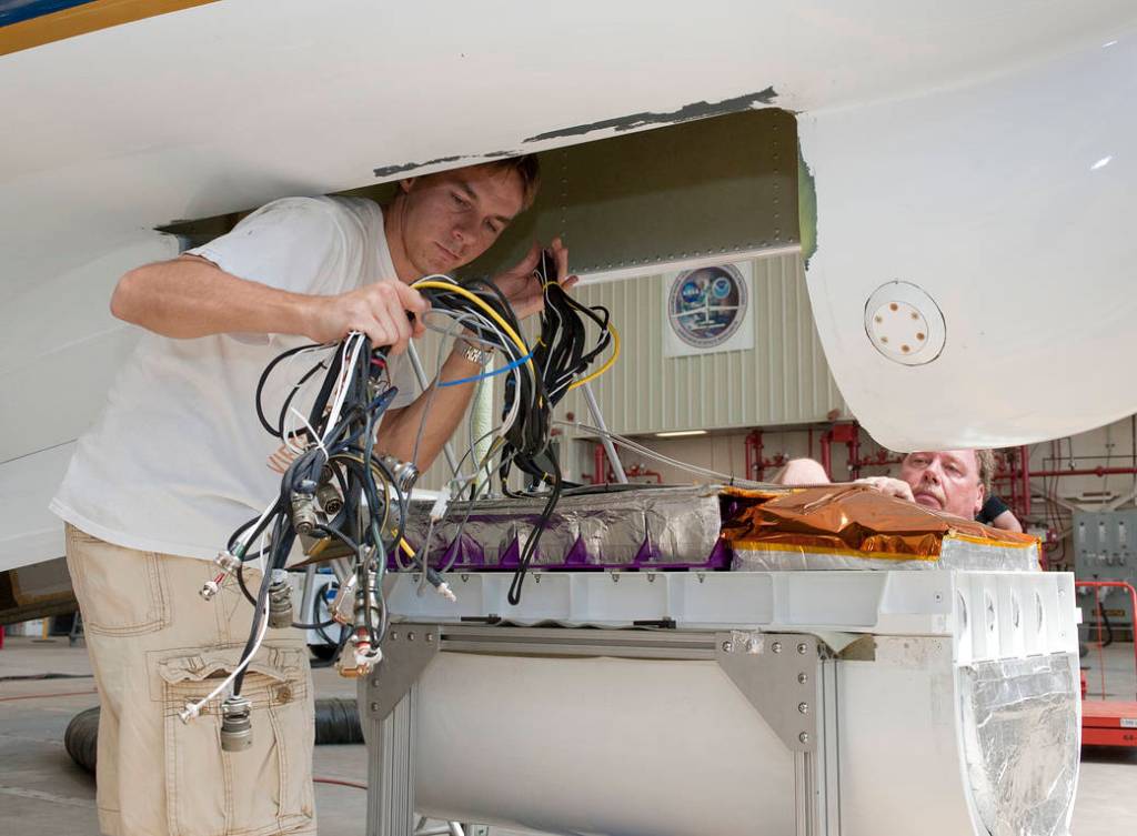 Support Scientist Installs Cloud Physics Lidar