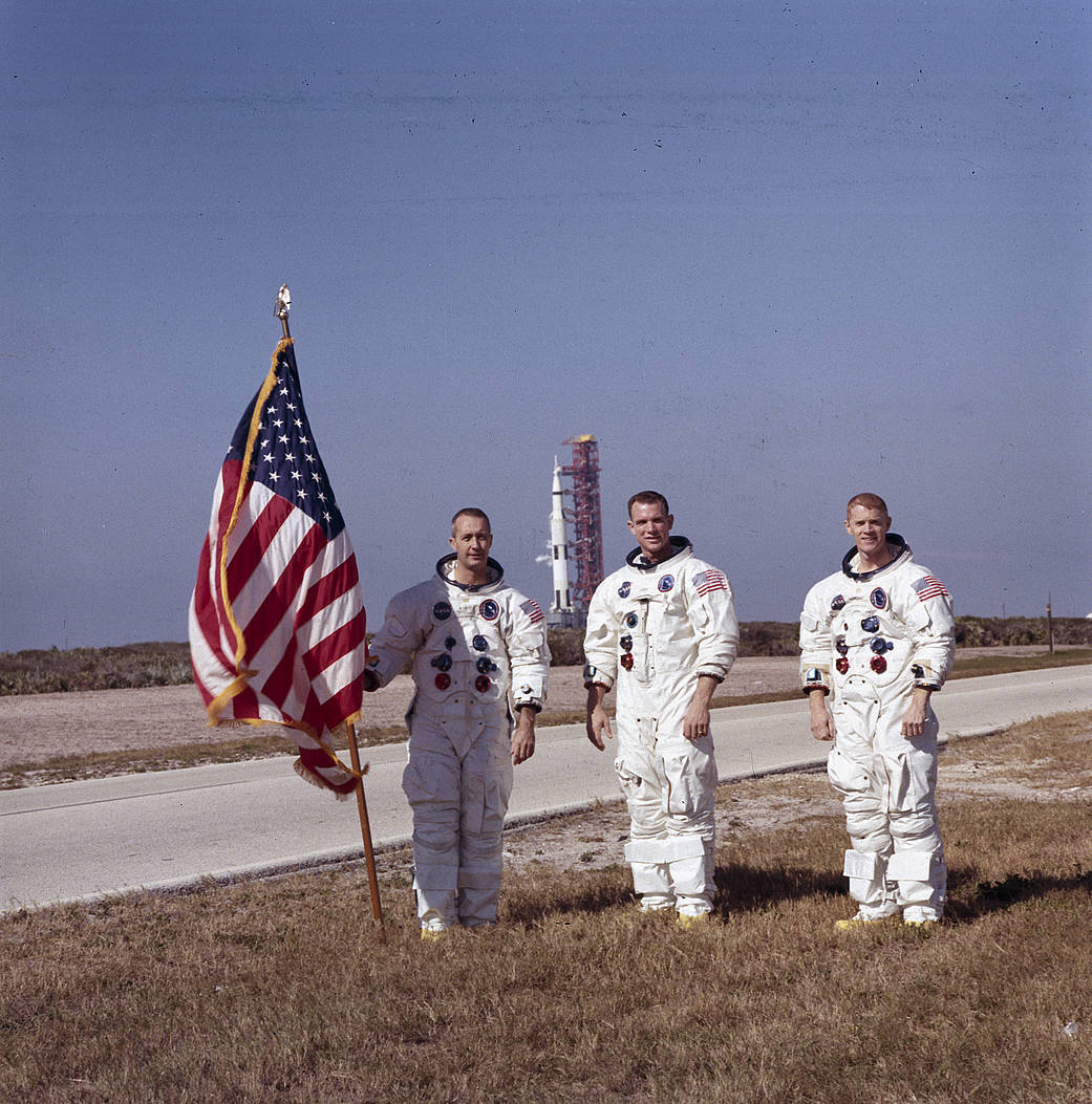 The Apollo 9 astronauts, left to right, James A. McDivitt, David R. Scott, and Russell L. Schweickart, pause in front of the Apo