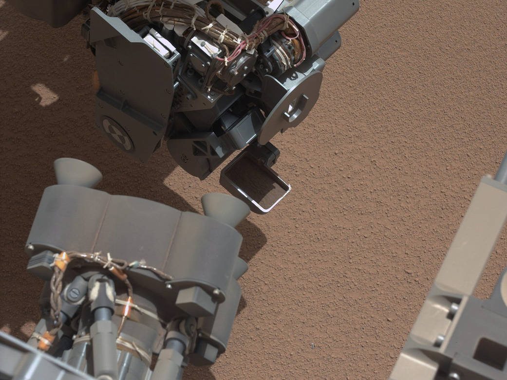 View of Curiosity's First Scoop Also Shows Bright Object