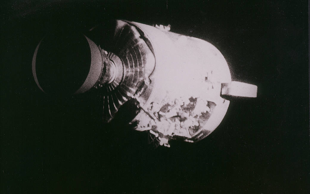 This view of the severely damaged Apollo 13 Service Module was photographed from the Lunar Module/Command Module.