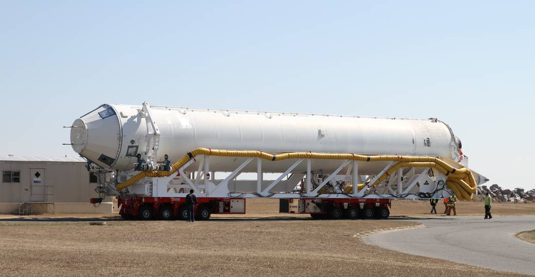 The Orbital Sciences Antares launch vehicle first stage used in the February 22 hot-fire engine test is rolled back to the Horiz