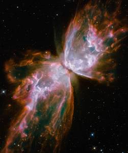 Cloud of gas resembling two large wings narrowed toward center against deep space