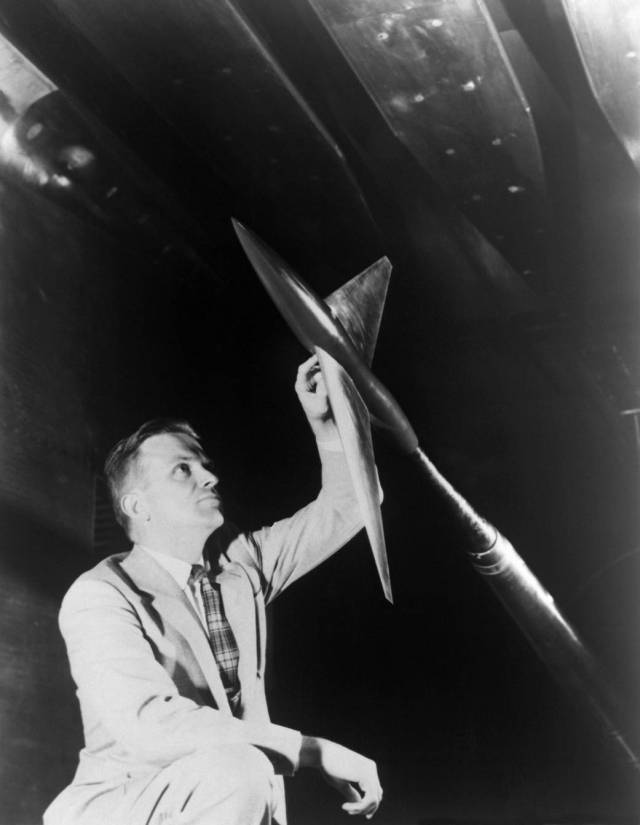 Richard Whitcomb examines a model designed in accordance with his transonic area rule. 