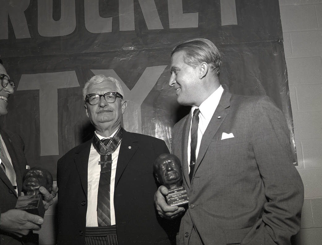 In this photo, Dr. Wernher von Braun holds the coveted Hermann Oberth award