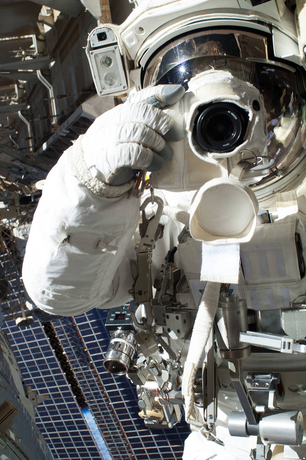 NASA astronaut Chris Cassidy, Expedition 36 flight engineer, uses a digital still camera during a session of extravehicular acti