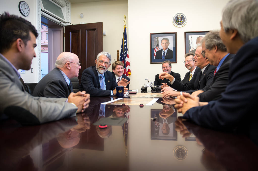 Dr. John Holdren, Director of the Office of Science and Technology Policy, 3rd from left, meets with members of the NASA Mars Sc