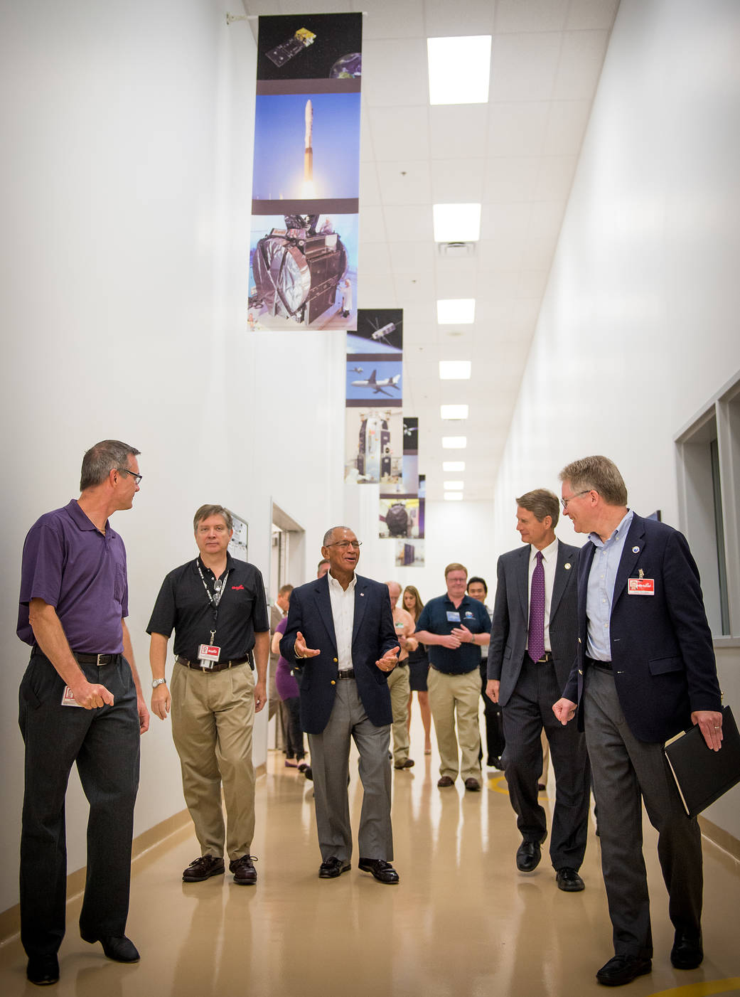 NASA Administrator Charles Bolden, center, tours Orbital Sciences Corporation's Gilbert, Arizona facility including the Orbiting