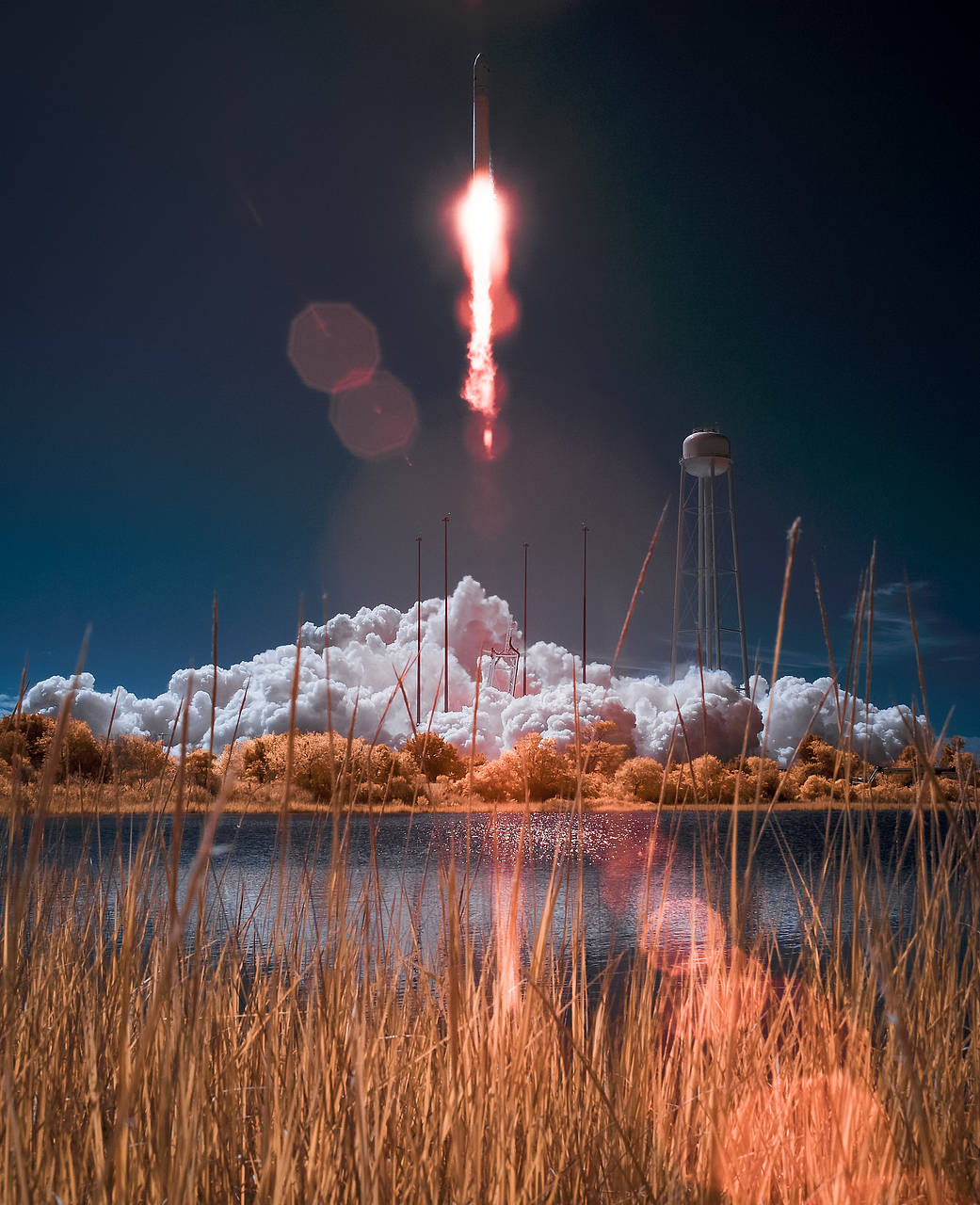 The Orbital Sciences Corporation Antares rocket, with the Cygnus cargo spacecraft aboard, is seen in this false color infrared i