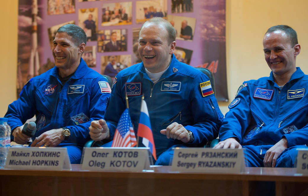 Expedition 37 NASA Flight Engineer Michael Hopkins, far left, Soyuz Commander Oleg Kotov and Flight Engineer Sergey Ryazanskiy