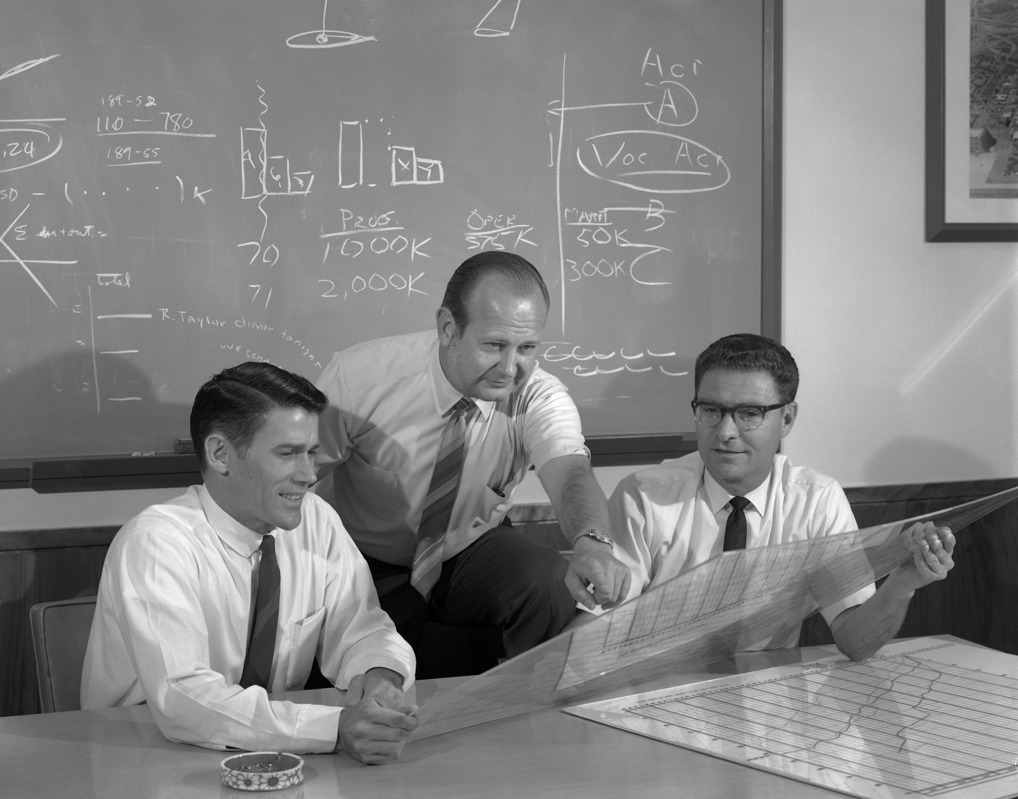 Ames Research Center Engineers discuss aircraft design and handling. Pictured are (left to right) Allen Faye, Merrill Mead, and John “Jack” Boyd. (21 Apr. 1970)