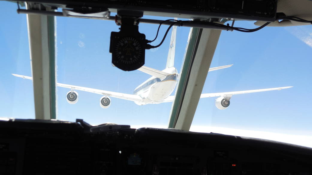 Researchers in chase aircraft flew as close as 300 feet behind the NASA DC-8 in the lead.