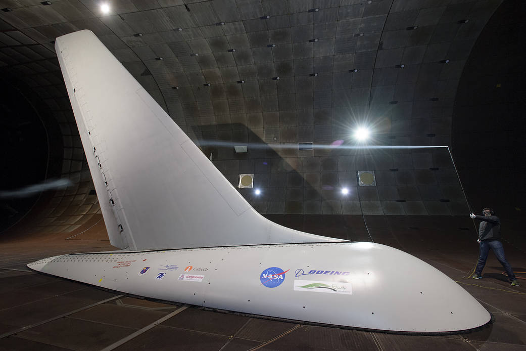 A full-sized tail from a 757 commercial airplane having air being blown across the tail.