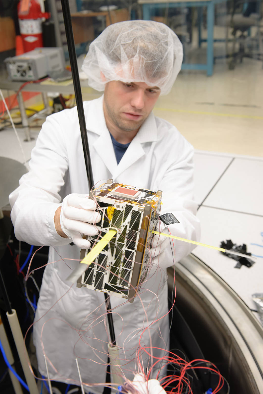 Nodes Satellites Being Removed from the Thermal Vacuum Chamber