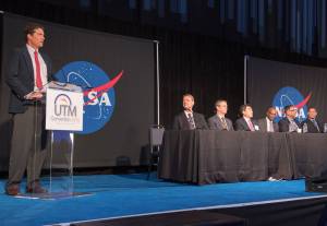 Speakers at the 2015 UTM Convention with Thomas Edwards at the podium.