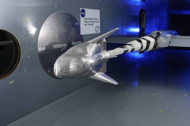 model of SNC Dream Chaser aircraft in wind tunnel