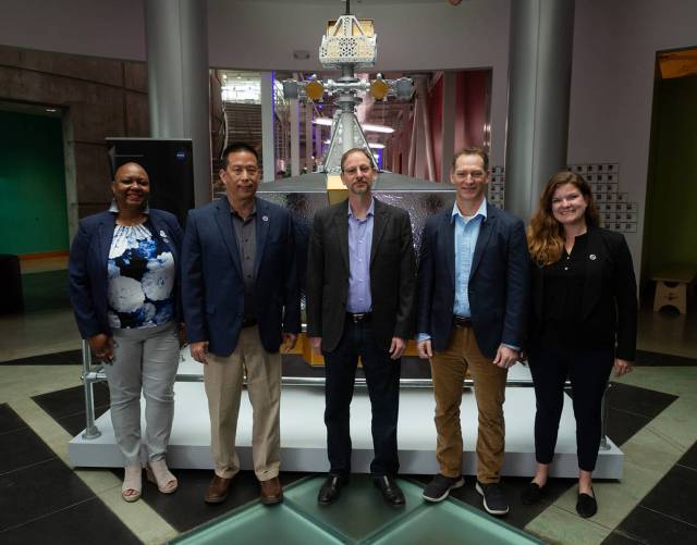 Joeletta Patrick, Director of NASA's California Office of STEM Engagement, Eugene Tu, Ames Center Director, Adam Tobin, Chabot Director, Ryan Vaughn, lead mission systems engineer, Cara Dodge, Ames Event Lead, in front of VIPER model.