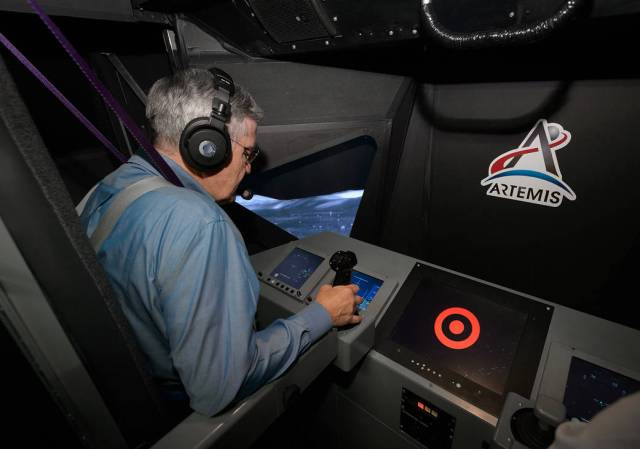 NASA Associate Administrator Bob Cabana pilots the lunar lander at the Vertical Motion Simulator (VMS) facility,