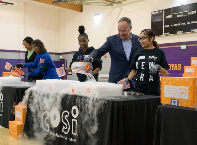 Second Gentleman Douglas Emhoff participates in a “Make a Cloud” demonstration with students and NASA astronaut Dr. Yvonne Cagle at the East Oakland Youth Development Center in Oakland, California.