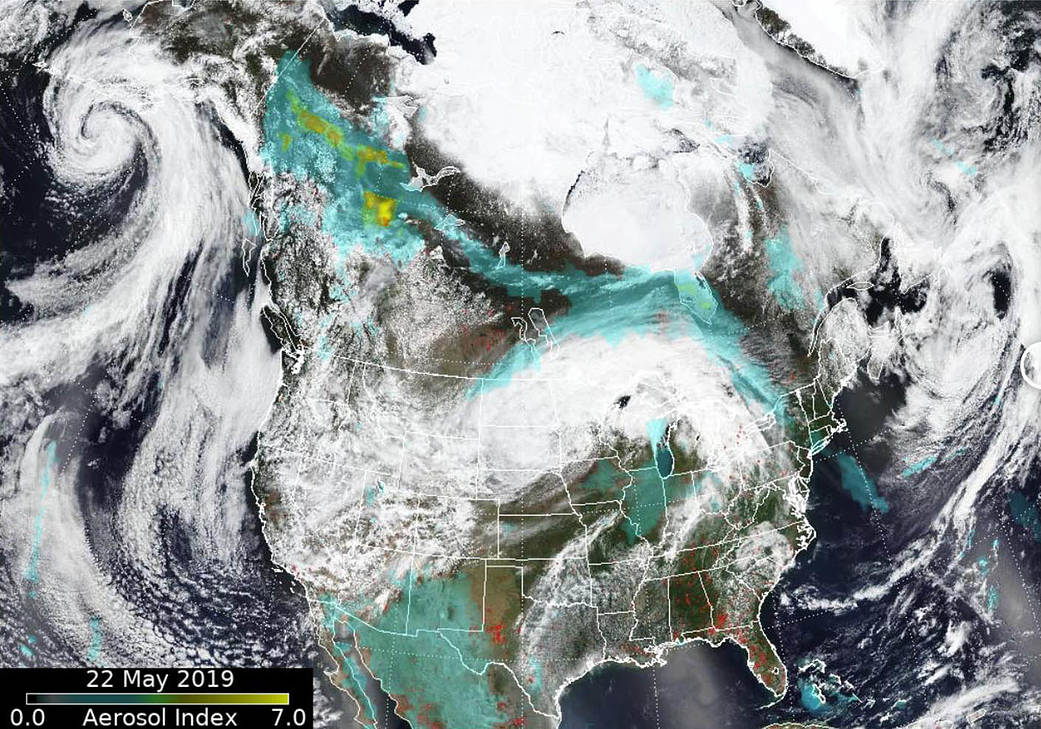 Aerosols from fires to the north and south extend from Alaska to the Atlantic.
