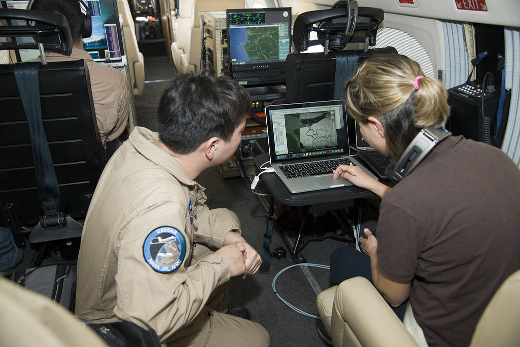 Sam Choi and Naiara Pinto observe Google Earth overlaid with in almost real time what the synthetic aperture radar is mapping fr