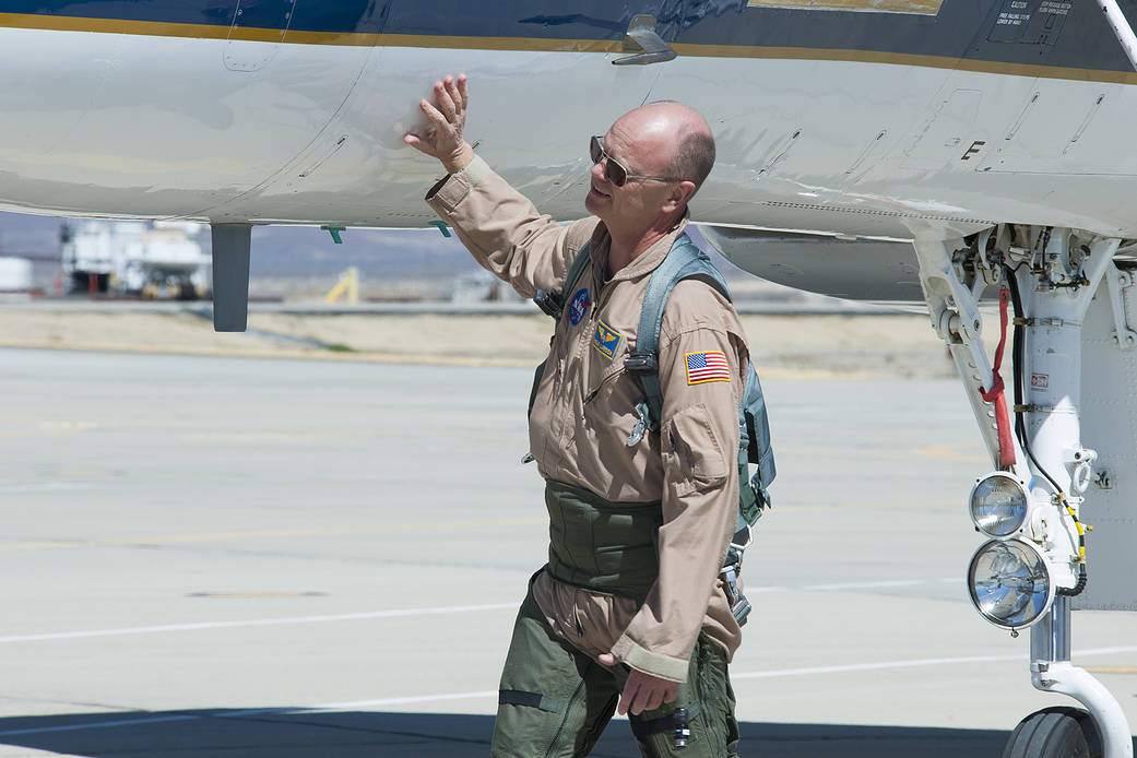 NASA pilot Nils Larson checks out the NASA F-15B aircraft before he climbs into the cockpit.
