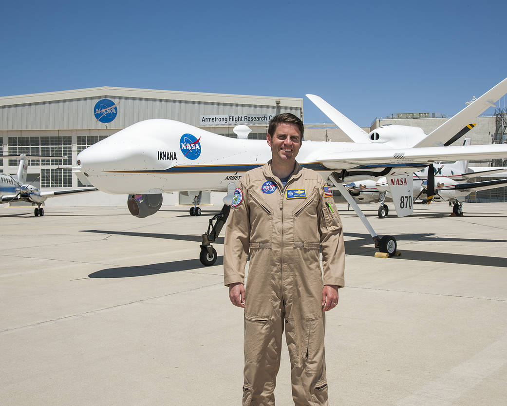 Scott Howe in front of Ikhana aircraft.