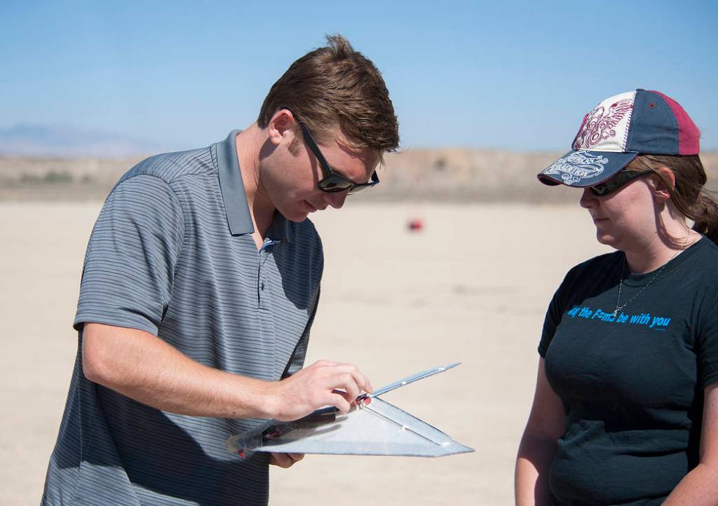 Emerson Baker and Caitlyn Kennedy check out the Prandtl-M before a test flight.