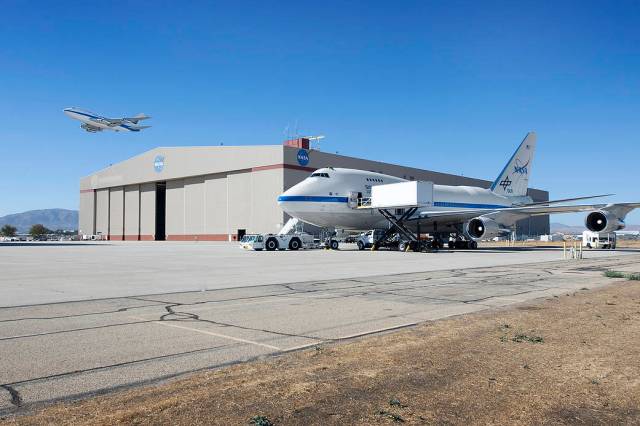 Pratt and Whitney Canada’s 747SP testbed departs NASA Armstrong Flight Research Center Building 703 in Palmdale, California.