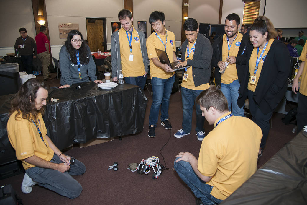 Gold Team students test their miniature Mars rover before attempting to complete a rescue challenge.