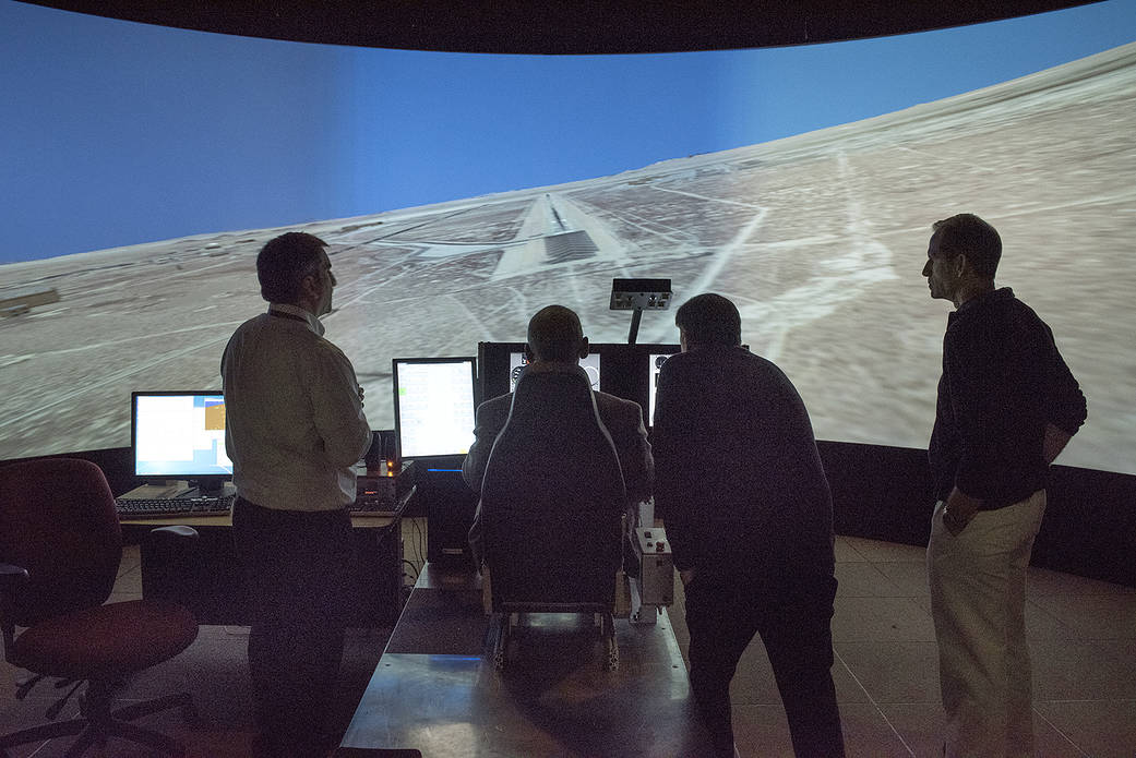 NASA Administrator Charlie Bolden at the controls of the X-57 simulator.