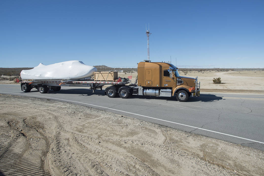 The Dream Chaser spacecraft pictured in California's desert as it heads to Edwards Air Force Base.