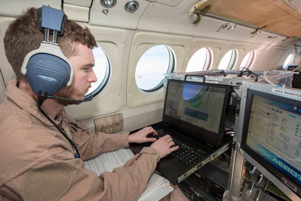 Instrument Operator Monitors Wind Data