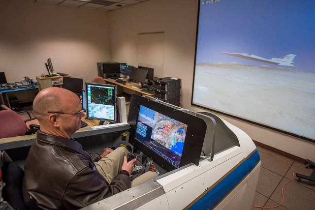 NASA pilot Nils Larson evaluates software in the X-59 simulator.