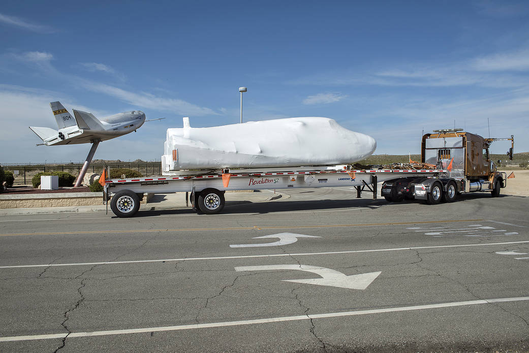 Dream Chaser departs in front of HL-10 at NASA Armstrong where it underwent testing.