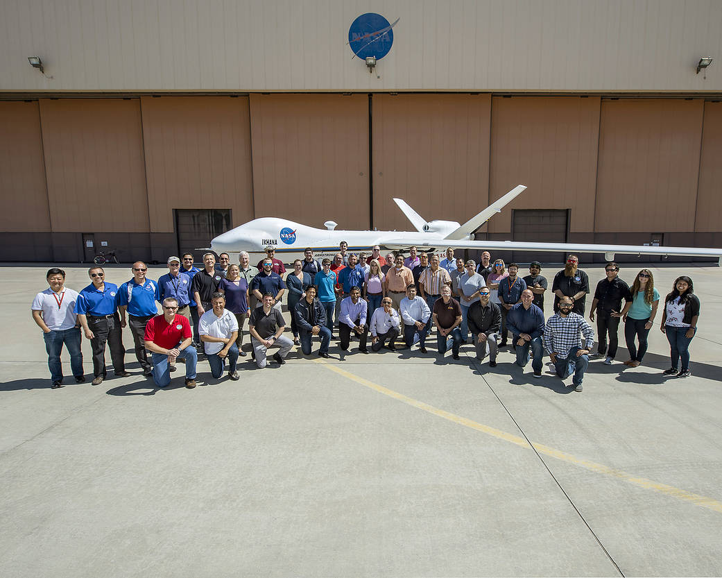 The No Chase COA (NCC) team at NASA Armstrong Flight Research Center pose for a group photo with the Ikhana.