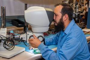 Clark Johnson inspects components tested in the Environmental Laboratory at NASA’s Armstrong Flight Research Center.