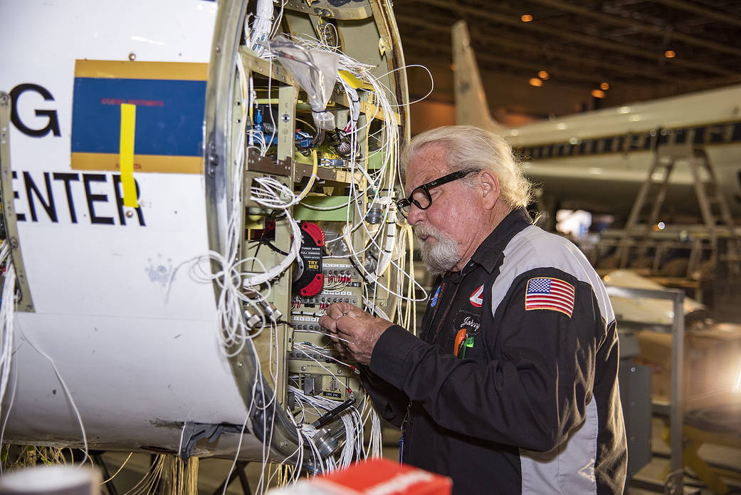 Technician Johnny Bryant works on rewiring the high-altitude aircraft’s fixed nose and cockpit.