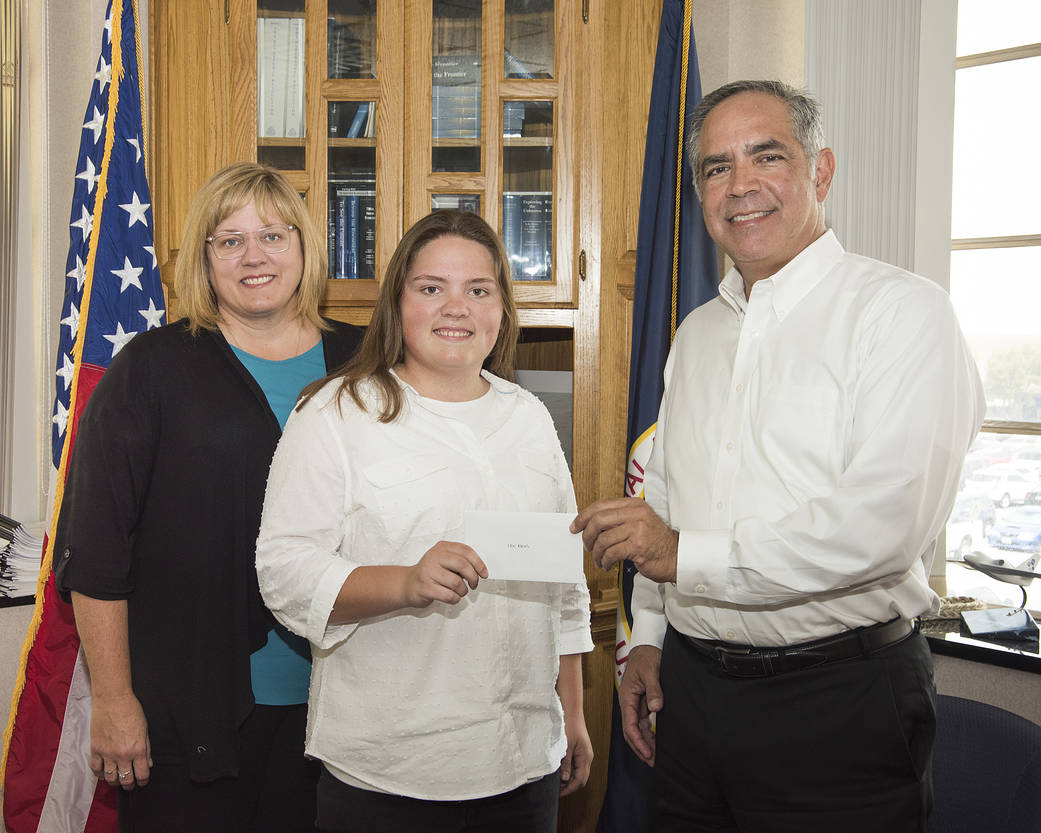 Erin Askins accepts the 2018 NASA Armstrong Exchange Harold W. Walker Memorial Scholarship from Center Director David McBride.