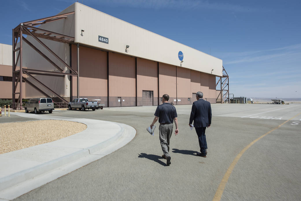 Bridenstine and McBride walking together at AFRC.