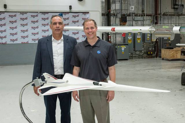 NASA Administrator Bridenstine stands with AFRC center director McBride by model NASA’s Supersonic X-Plane.