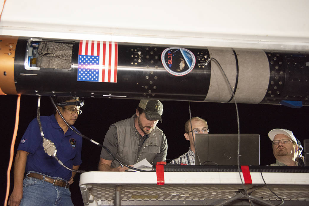 UP Aerospace employees preparing their SpaceLoft rocket to carry NASA technologies for testing in microgravity. 