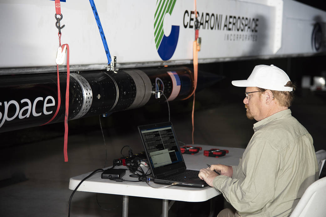 An UP Aerospace employee prepares their SpaceLoft rocket for a flight that will carry NASA technologies for testing.