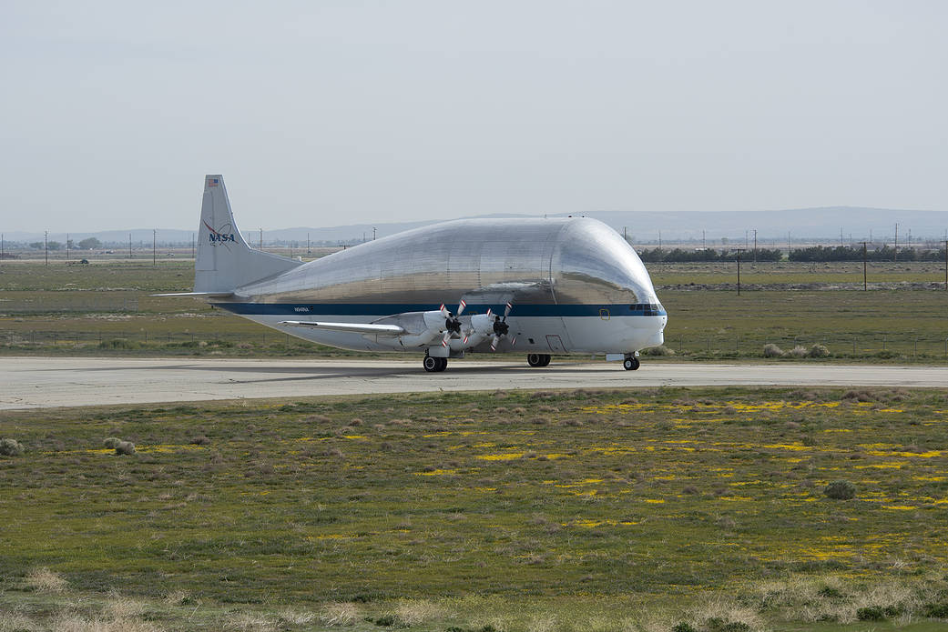 NASA’s Super Guppy cargo transport aircraft taxis in from the Plant 42 runway to NASA’s AFRC's Building 703.